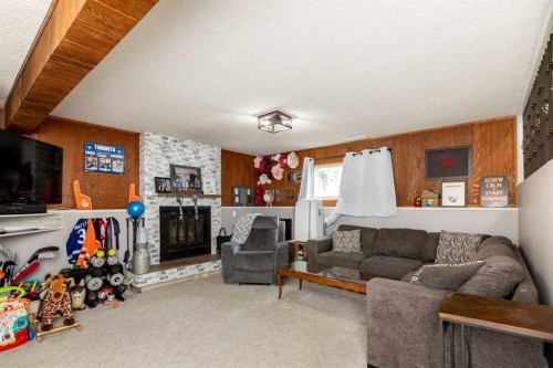 62 Rupert Crescent, Red Deer, AB - Indoor Photo Showing Living Room With Fireplace