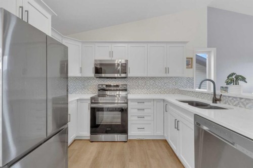 26 Mckinlay Crescent, Lacombe, AB - Indoor Photo Showing Kitchen With Double Sink With Upgraded Kitchen