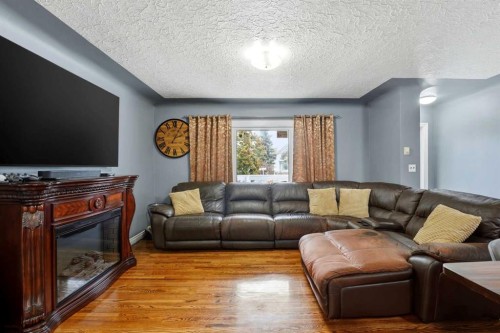 4624 49 Street, Red Deer, AB - Indoor Photo Showing Living Room With Fireplace