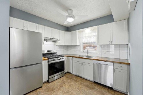 4624 49 Street, Red Deer, AB - Indoor Photo Showing Kitchen With Stainless Steel Kitchen With Double Sink