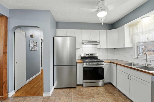 4624 49 Street, Red Deer, AB - Indoor Photo Showing Kitchen With Stainless Steel Kitchen With Double Sink