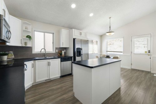 65 Macewan Ridge Circle Nw, Calgary, AB - Indoor Photo Showing Kitchen With Double Sink