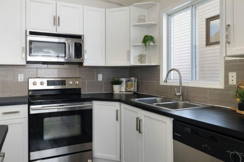 65 Macewan Ridge Circle Nw, Calgary, AB - Indoor Photo Showing Kitchen With Double Sink With Upgraded Kitchen