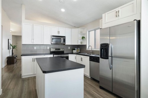65 Macewan Ridge Circle Nw, Calgary, AB - Indoor Photo Showing Kitchen With Double Sink