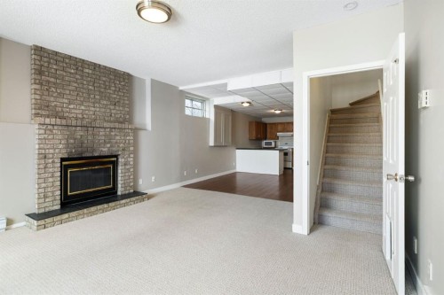 65 Macewan Ridge Circle Nw, Calgary, AB - Indoor With Fireplace