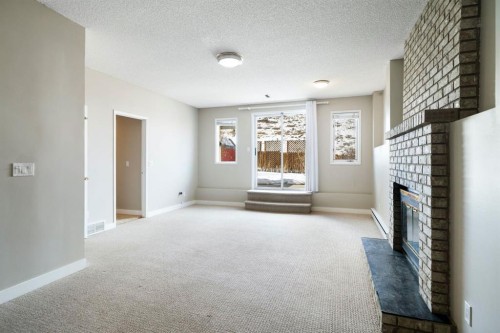 65 Macewan Ridge Circle Nw, Calgary, AB - Indoor With Fireplace