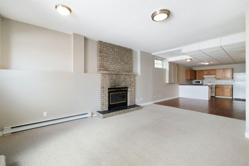 65 Macewan Ridge Circle Nw, Calgary, AB - Indoor With Fireplace