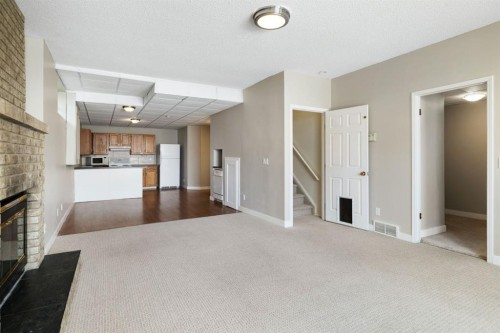 65 Macewan Ridge Circle Nw, Calgary, AB - Indoor With Fireplace