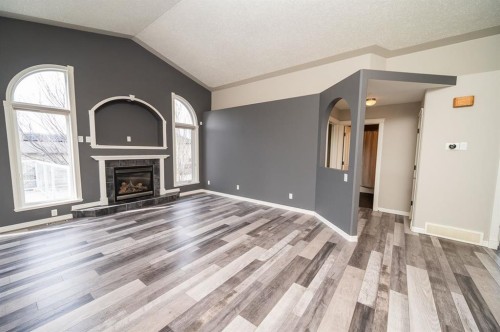 60 Daniel Close, Red Deer, AB - Indoor Photo Showing Other Room With Fireplace