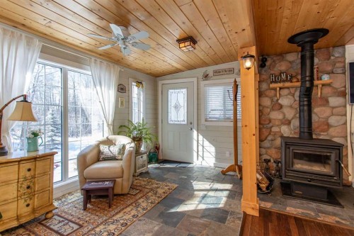 1130 Breakers Way, Sunbreaker Cove, AB - Indoor Photo Showing Other Room With Fireplace