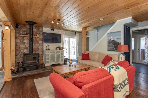 1130 Breakers Way, Sunbreaker Cove, AB - Indoor Photo Showing Living Room With Fireplace