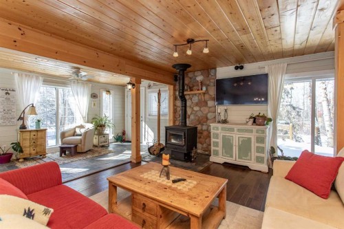 1130 Breakers Way, Sunbreaker Cove, AB - Indoor Photo Showing Living Room With Fireplace