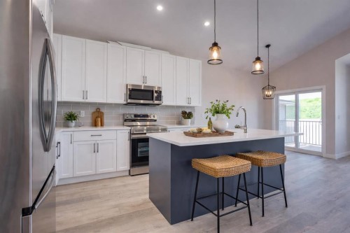 117 Gray Close, Sylvan Lake, AB - Indoor Photo Showing Kitchen With Stainless Steel Kitchen With Upgraded Kitchen
