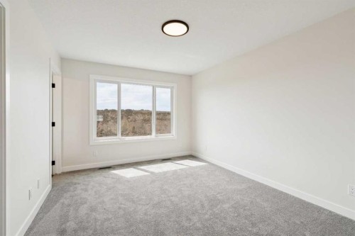 64 Southborough Common, Cochrane, AB - Indoor Photo Showing Other Room