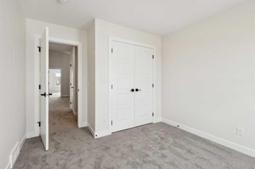 64 Southborough Common, Cochrane, AB - Indoor Photo Showing Other Room