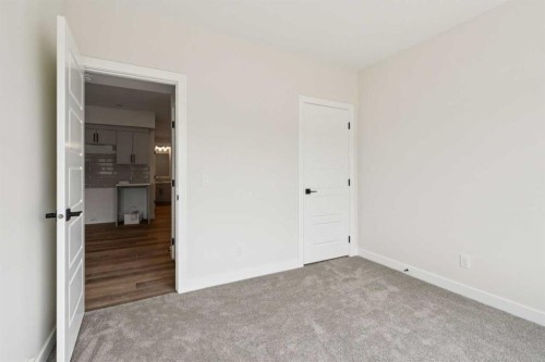64 Southborough Common, Cochrane, AB - Indoor Photo Showing Other Room