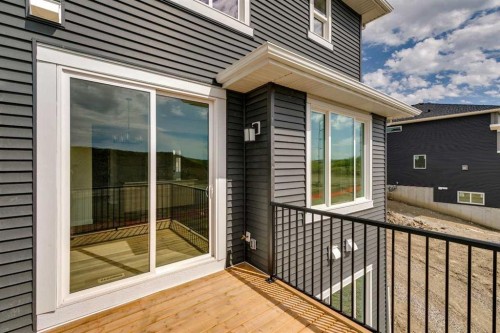 64 Southborough Common, Cochrane, AB - Outdoor With Exterior