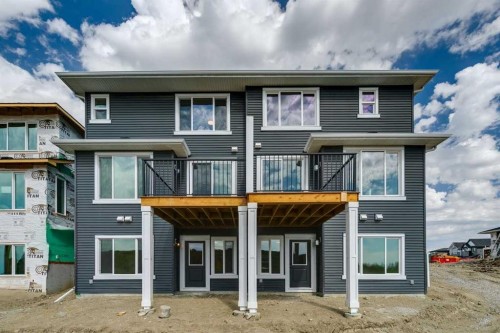64 Southborough Common, Cochrane, AB - Outdoor With Facade