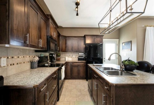 67 Bowman Circle, Sylvan Lake, AB - Indoor Photo Showing Kitchen With Double Sink