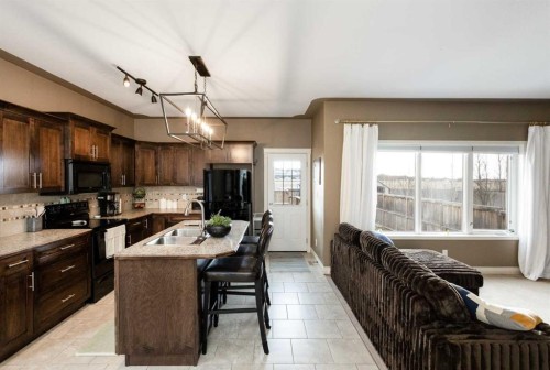 67 Bowman Circle, Sylvan Lake, AB - Indoor Photo Showing Kitchen With Double Sink