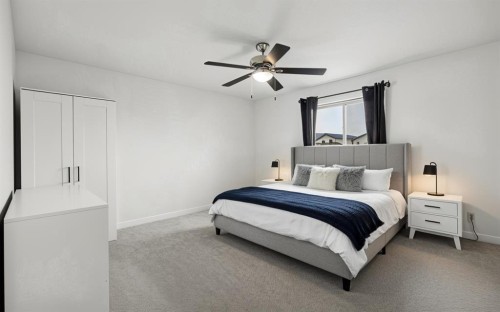 32 Hunter Road, Sylvan Lake, AB - Indoor Photo Showing Bedroom