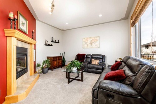 64 Lacey Close, Red Deer, AB - Indoor Photo Showing Living Room With Fireplace