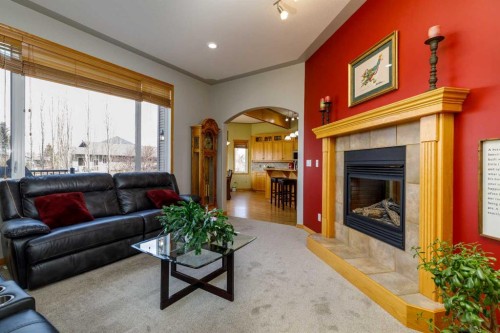 64 Lacey Close, Red Deer, AB - Indoor Photo Showing Living Room With Fireplace