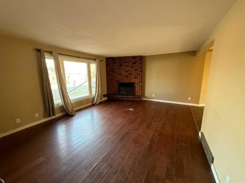 5805 42 Avenue, Camrose, AB - Indoor Photo Showing Living Room With Fireplace