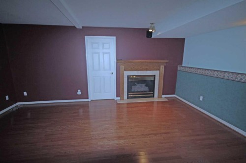 25 Willow Springs Crescent, Sylvan Lake, AB - Indoor With Fireplace