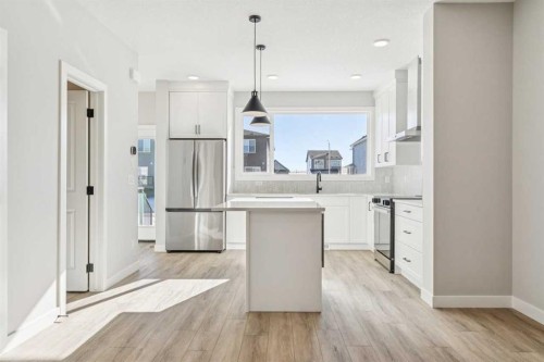 335 Fireside Drive, Cochrane, AB - Indoor Photo Showing Kitchen With Upgraded Kitchen