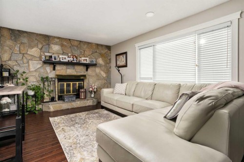 6313 Erickson Drive, Camrose, AB - Indoor Photo Showing Living Room With Fireplace