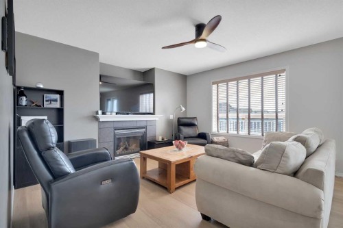 19 Oxley Close, Red Deer, AB - Indoor Photo Showing Living Room With Fireplace
