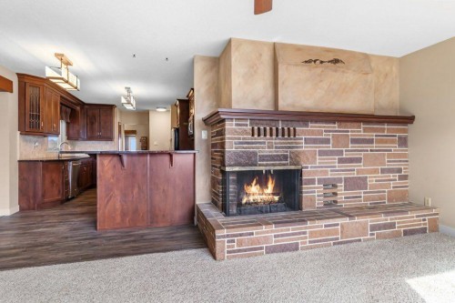 34128 Range Road 21, Rural Red Deer County, AB - Indoor Photo Showing Other Room With Fireplace