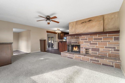 34128 Range Road 21, Rural Red Deer County, AB - Indoor Photo Showing Other Room With Fireplace