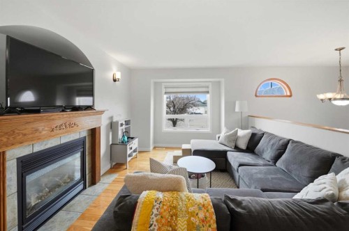 44 Duval Close, Red Deer, AB - Indoor Photo Showing Living Room With Fireplace