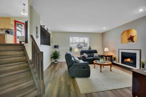 88 Premiere Crescent, Blackfalds, AB - Indoor Photo Showing Living Room With Fireplace