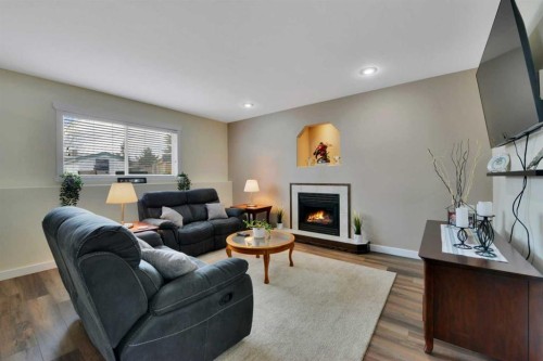 88 Premiere Crescent, Blackfalds, AB - Indoor Photo Showing Living Room With Fireplace