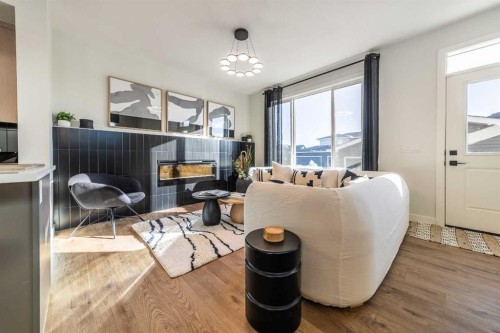 222 Layton Link Se, Airdrie, AB - Indoor Photo Showing Living Room With Fireplace