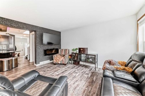 42 Jade Place, Red Deer, AB - Indoor Photo Showing Living Room With Fireplace