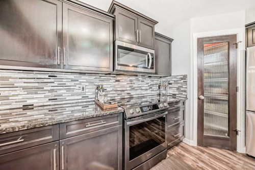 42 Jade Place, Red Deer, AB - Indoor Photo Showing Kitchen With Upgraded Kitchen