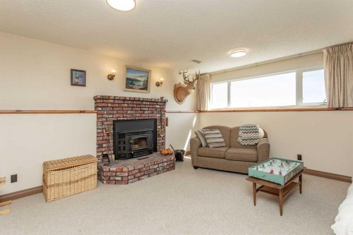 13 43 Avenue Close, Lacombe, AB - Indoor Photo Showing Living Room With Fireplace