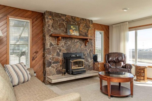 13 43 Avenue Close, Lacombe, AB - Indoor Photo Showing Living Room With Fireplace