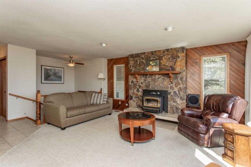 13 43 Avenue Close, Lacombe, AB - Indoor Photo Showing Living Room With Fireplace