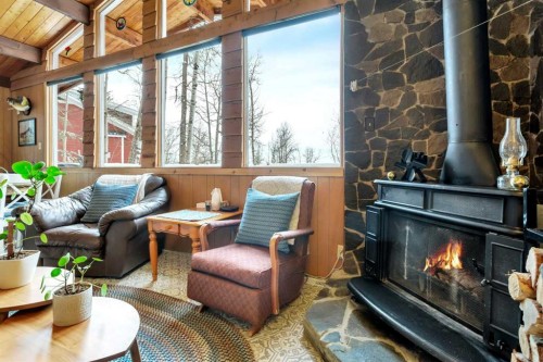 1225 Breakers Way, Sunbreaker Cove, AB - Indoor Photo Showing Other Room With Fireplace