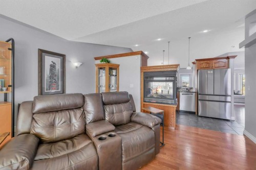 82 Ingram Close, Red Deer, AB - Indoor Photo Showing Living Room With Fireplace