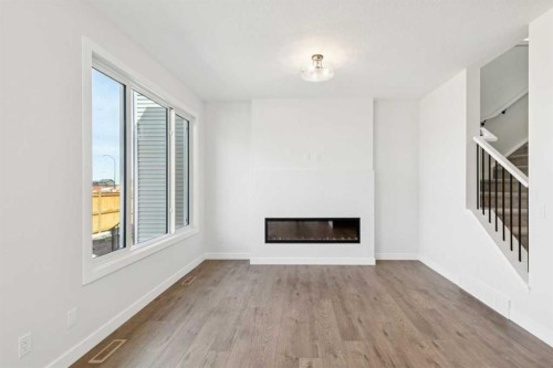 599 Buffaloberry Manor Se, Calgary, AB - Indoor With Fireplace
