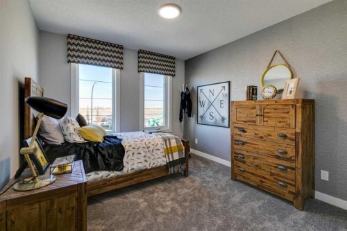 94 Bridgeport Landing, Chestermere, AB - Indoor Photo Showing Bedroom