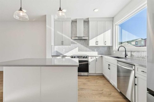 339 Fireside Drive, Cochrane, AB - Indoor Photo Showing Kitchen With Upgraded Kitchen