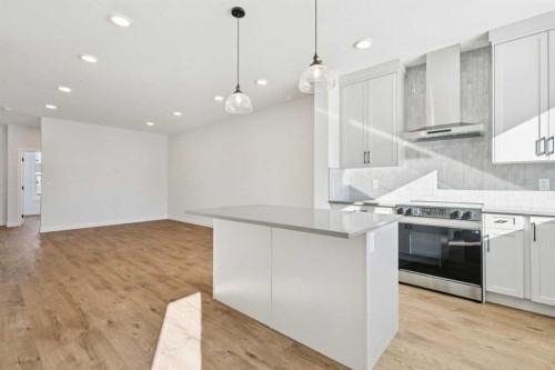 339 Fireside Drive, Cochrane, AB - Indoor Photo Showing Kitchen With Upgraded Kitchen