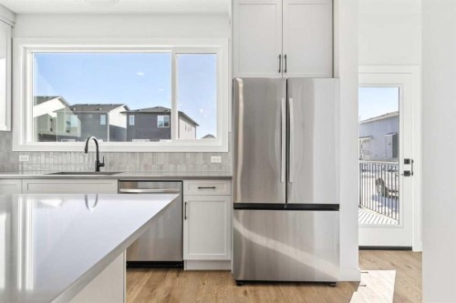339 Fireside Drive, Cochrane, AB - Indoor Photo Showing Kitchen With Upgraded Kitchen